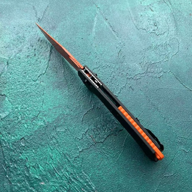 Benchmade 15535 Bugout – Carbon Fiber Handle, Orange Blade - Image 2