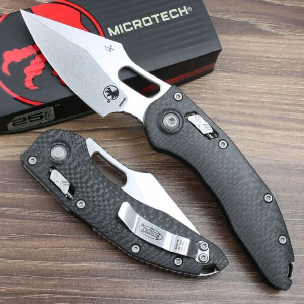 Back view of the Microtech Stitch RAM-LOK folding knife featuring a carbon fiber handle