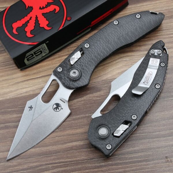 Front view of the Microtech Stitch RAM-LOK folding knife with a carbon fiber handle