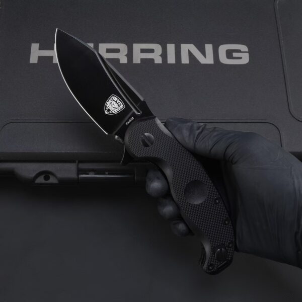 Handheld display of FOX IRVES FX-532 folding knife with black handle