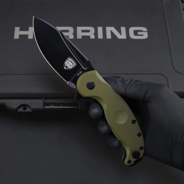 Handheld view of FOX IRVES FX-532 folding knife with green handle in open position