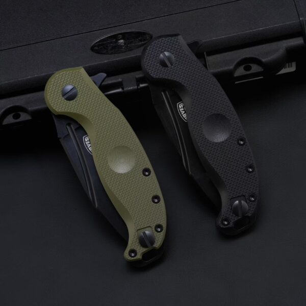 FOX IRVES FX-532 folding knives with green and black handles shown in folded position