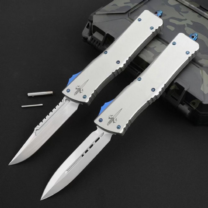 Front view of Microtech Ultratech OTF automatic knife featuring a mirror polish blade in deployed position