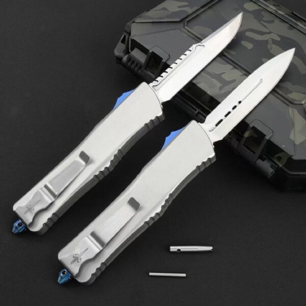 Rear view of Microtech Ultratech OTF automatic knife showing handle design and hardware with mirror polish blade