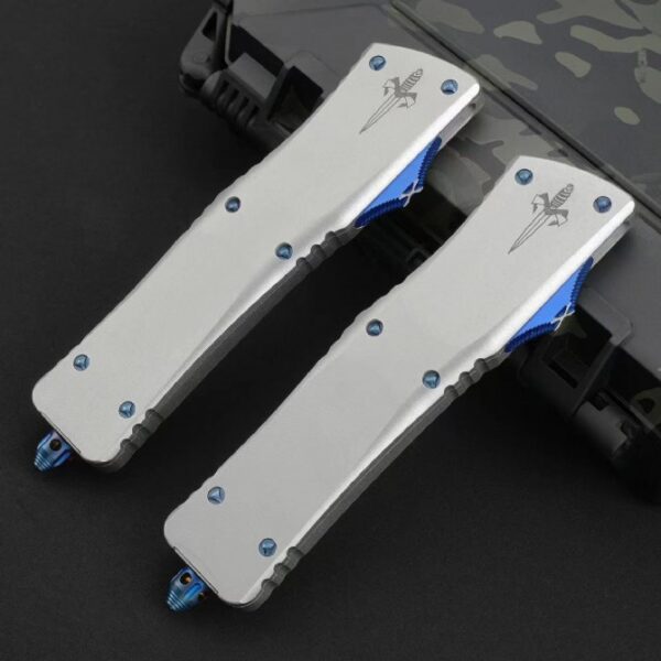 Front view of Microtech Ultratech OTF automatic knife in retracted position with mirror polish blade