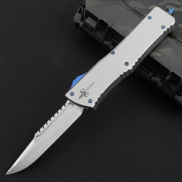 Microtech Ultratech OTF automatic knife featuring a single-edge partial serrated mirror polish blade