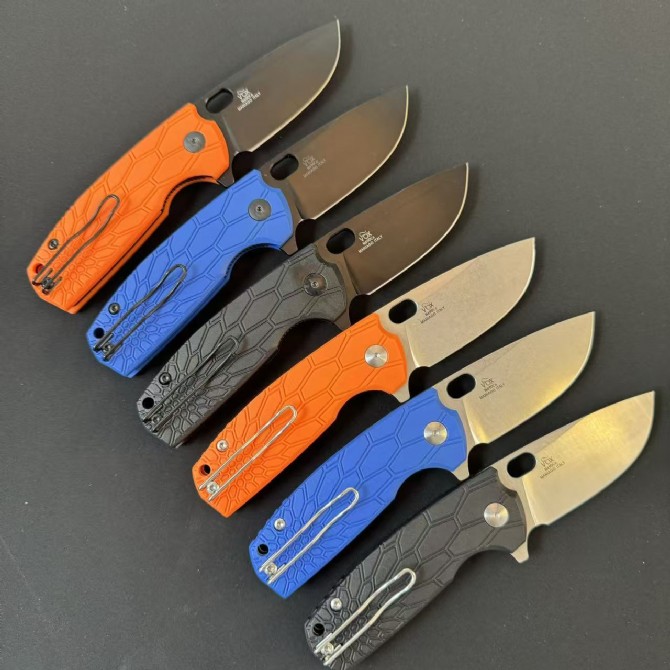 Rear view of six FOX FX-604 folding knives with FRN handles displayed in open position