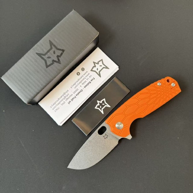 FOX FX-604 folding knife with orange FRN handle and satin blade shown deployed