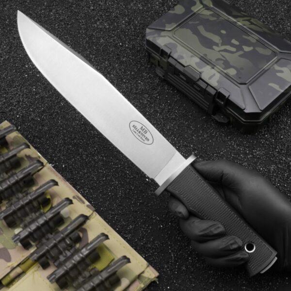 Handheld view of Fallkniven MB10 Modern Bowie fixed blade knife showing grip and size