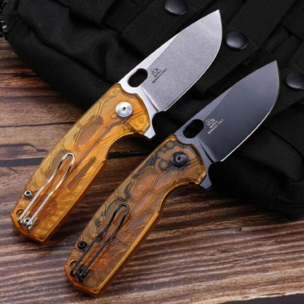 Rear view of two folding knives displayed in open position
