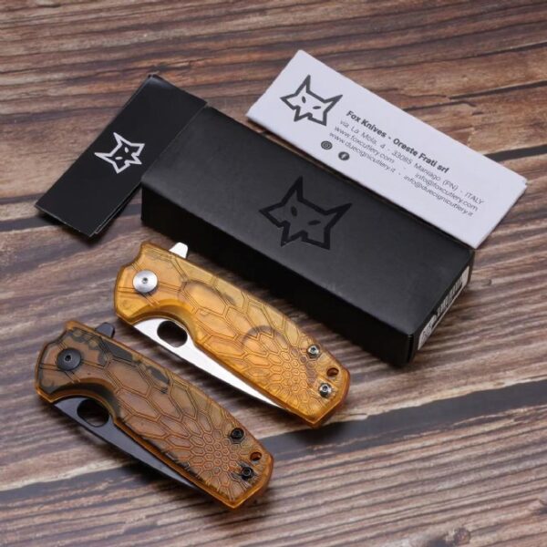 Two folding knives shown in folded position with original packaging