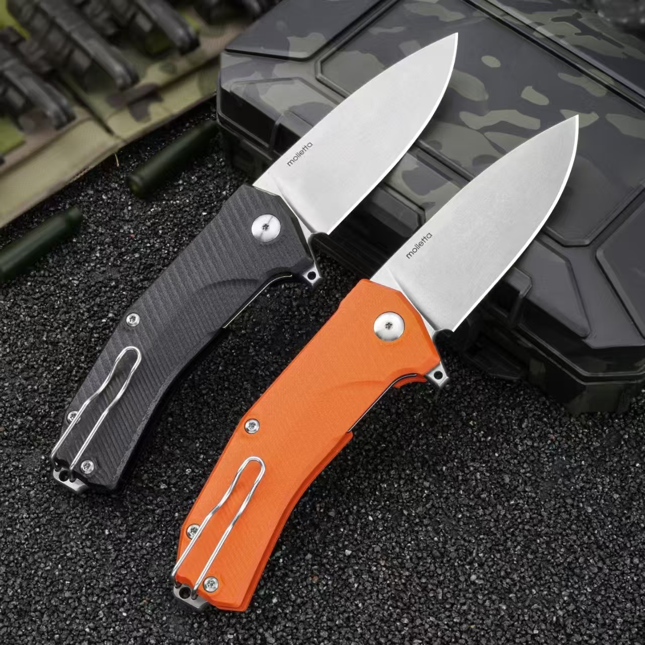 Rear view of LionSteel Sleeper folding knives with stonewashed blades and black and orange G10 handles in open position