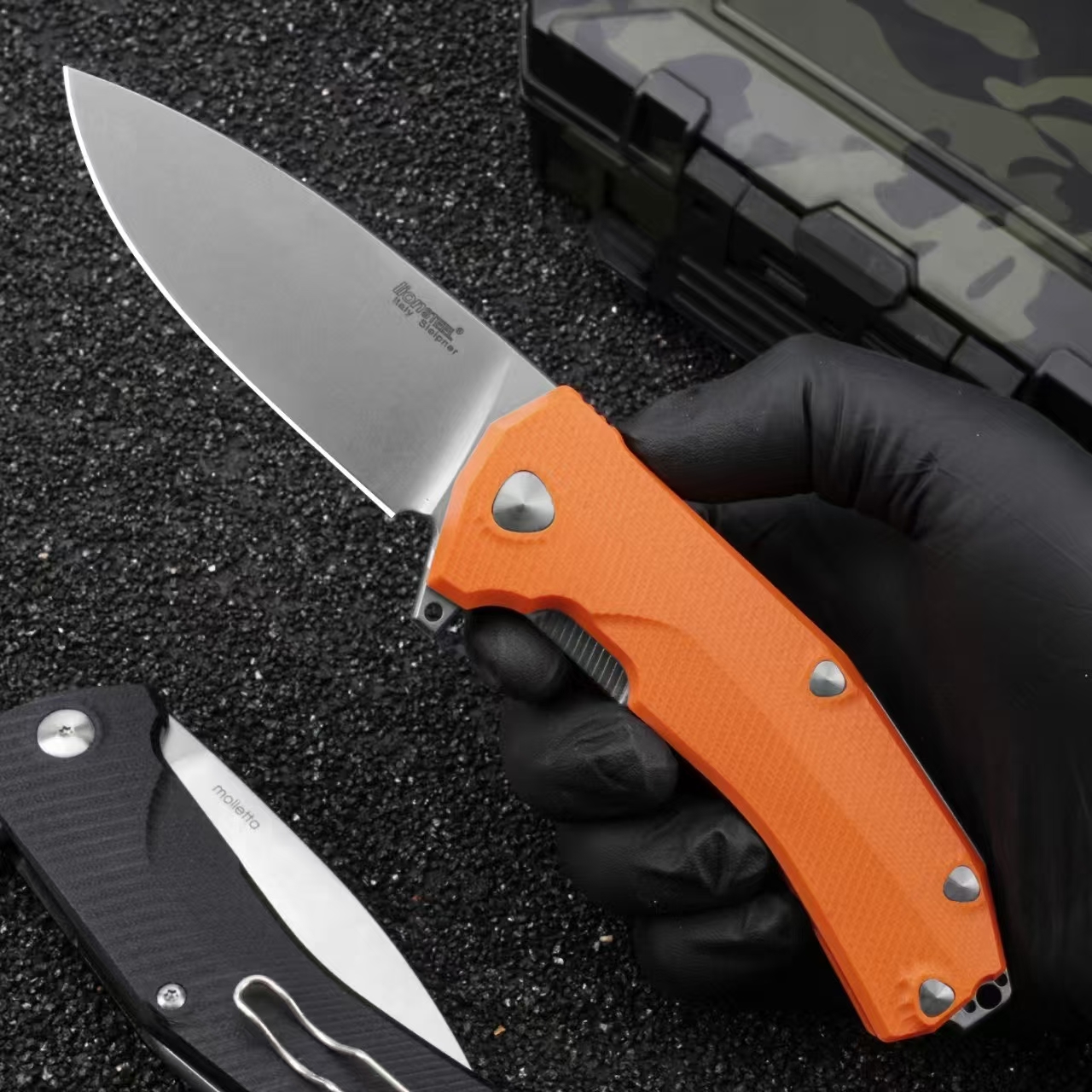 Handheld view of LionSteel Sleeper folding knife with orange G10 handle and stonewashed blade