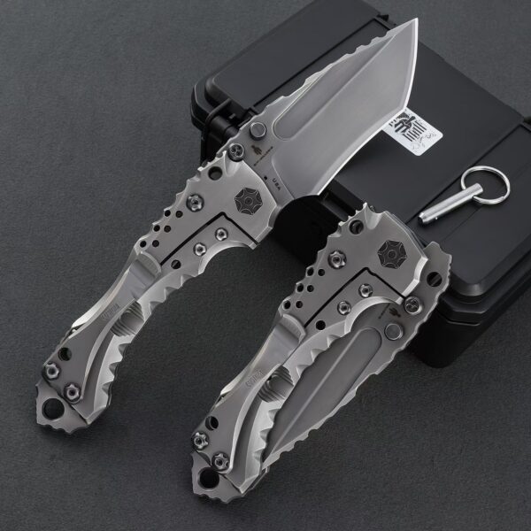 Rear detail of Miller Bros T1 Series heavy-duty folding knife displayed deployed and folded