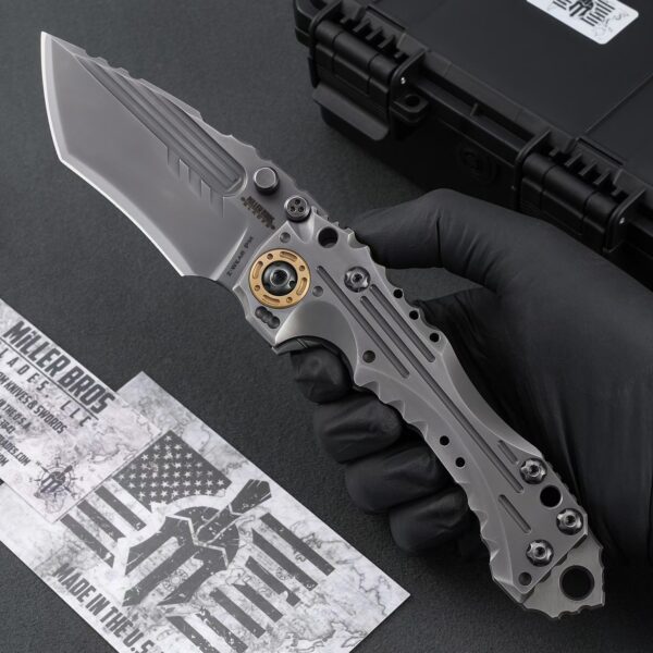 Handheld close-up of Miller Bros T1 Series heavy-duty tactical folding knife