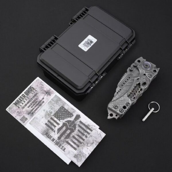 Miller Bros T1 Series Jurassic folding knife shown in folded position with original packaging