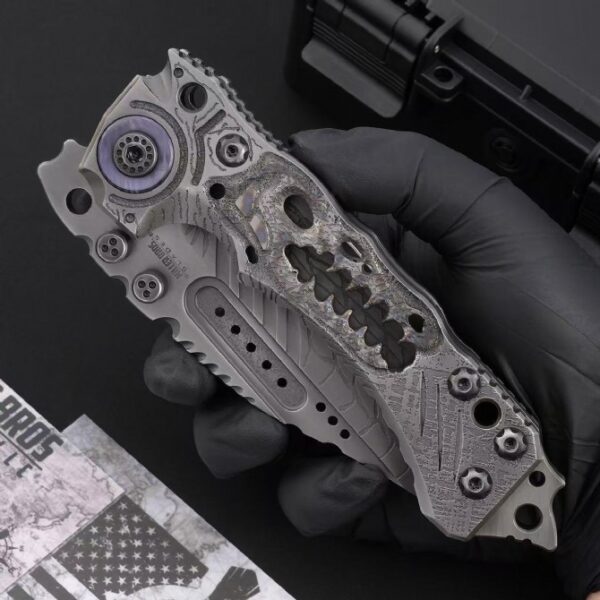 Handheld display of Miller Bros T1 Series Jurassic folding knife in folded position